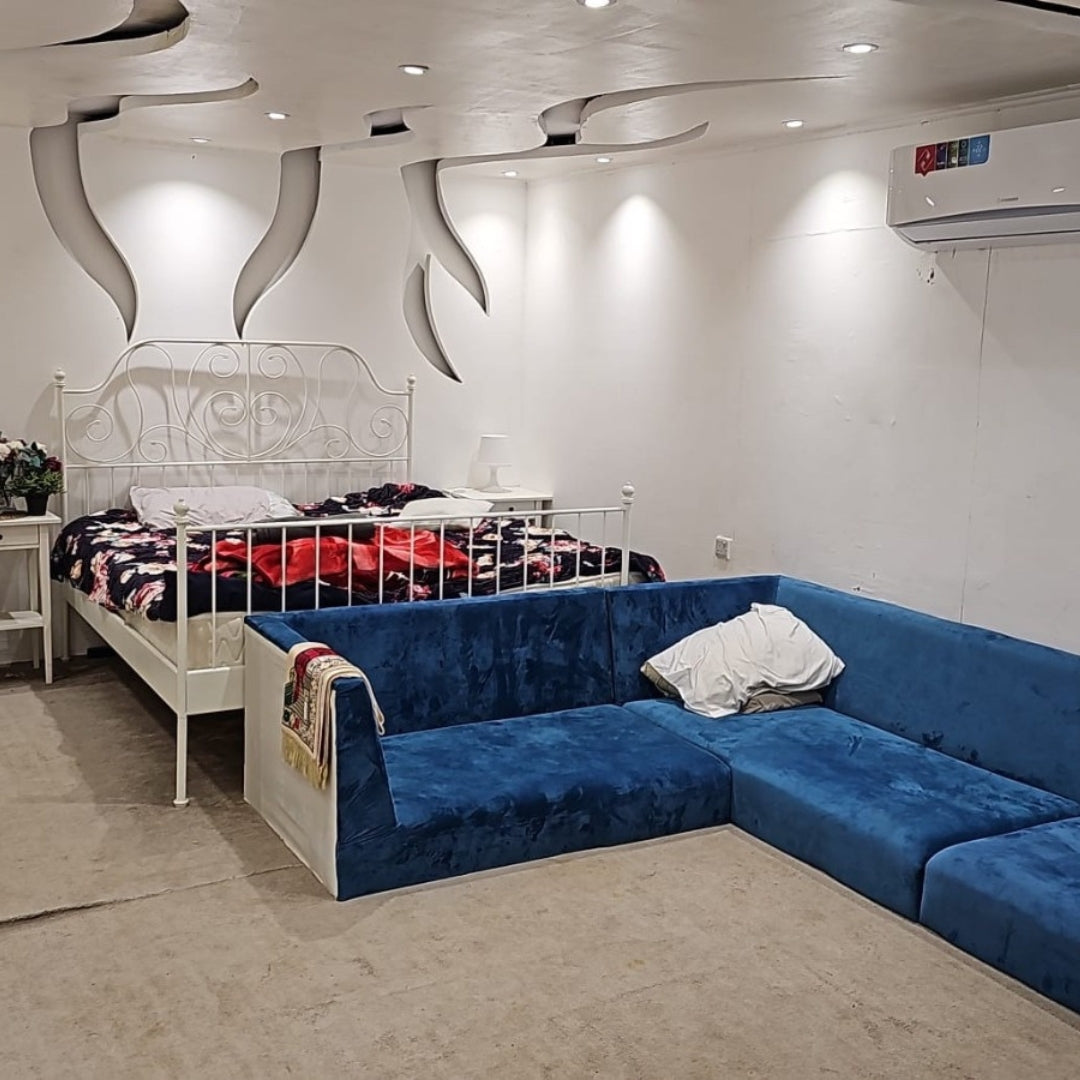 Night view of Al Khor Desert Camp featuring cozy lighting and a relaxing atmosphere for group stays.