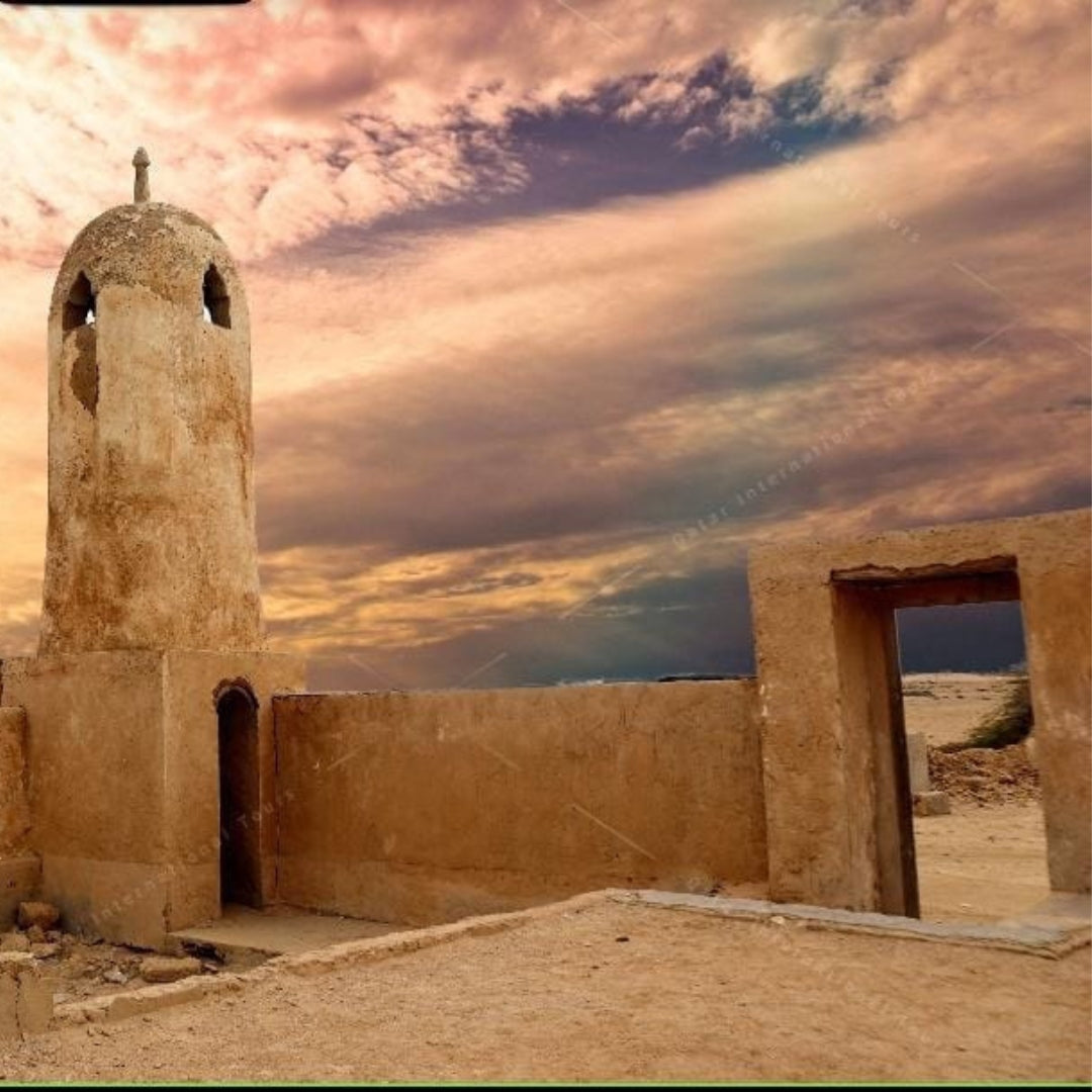 A historic fort, with views of natural landscapes and ancient structures during the North of Qatar Historical Tour.