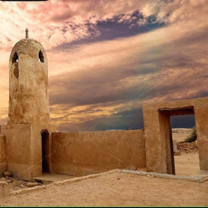 A historic fort, with views of natural landscapes and ancient structures during the North of Qatar Historical Tour.