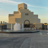 Private city tour car parked near Doha’s iconic Corniche, offering personalized sightseeing with a guide.