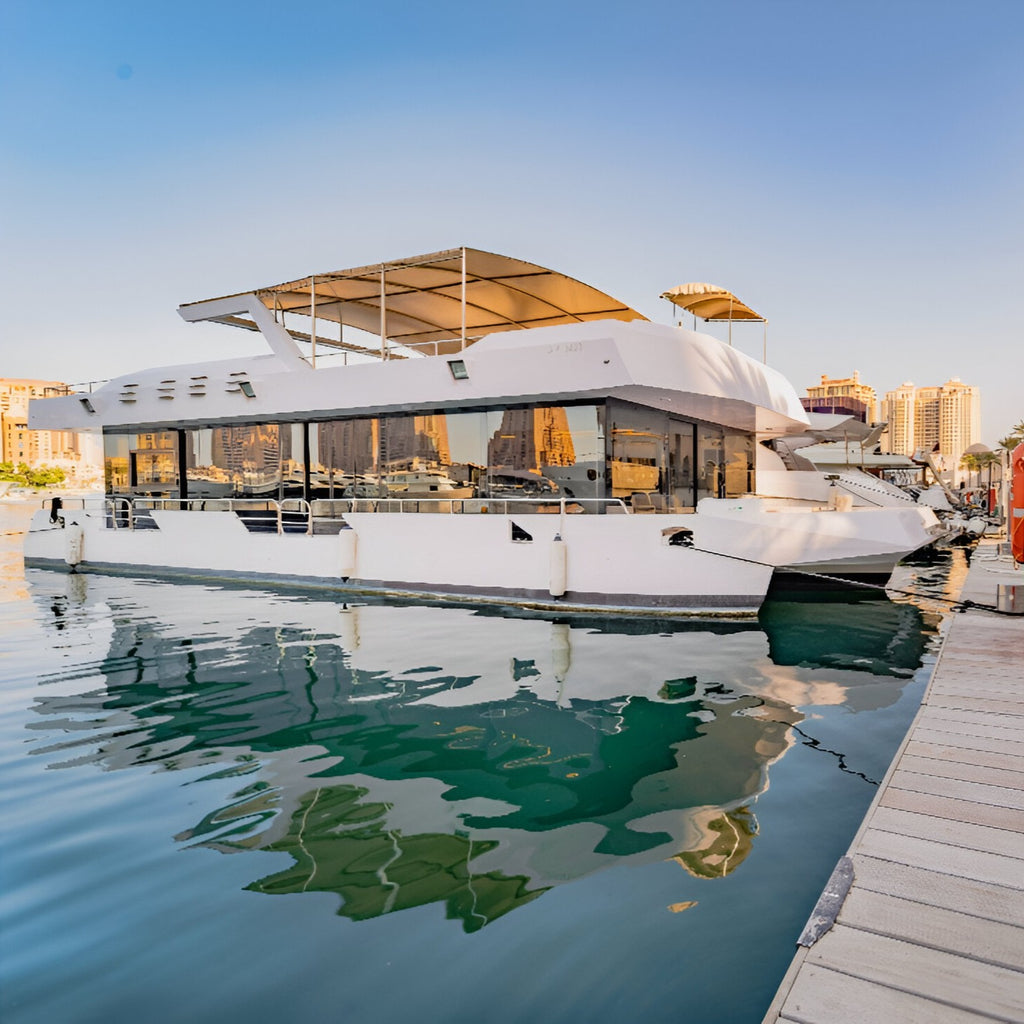 Set sail with the Tawash House Boat, a spacious retreat ideal for family outings and celebrations — offering comfort, refreshments, and beautiful views on the Arabian Gulf.