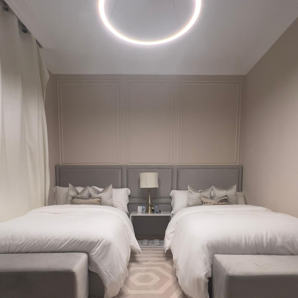 Bedroom view inside The Key Apartment with elegant lighting and a relaxing ambiance.