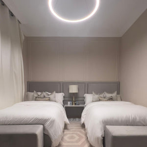 Bedroom view inside The Key Apartment with elegant lighting and a relaxing ambiance.